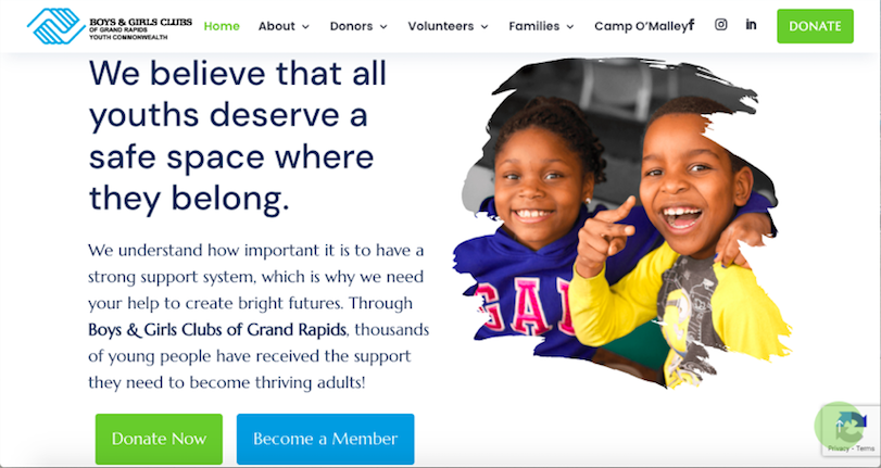 Website banner for Boys & Girls Clubs of Grand Rapids. Text reads "We believe that all youths deserve a safe space where they belong." Two children smile while holding art supplies. Buttons for "Donate Now" and "Become a Member." Check out our web development case study to see the impact we make.